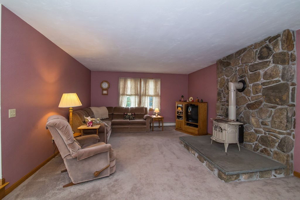 64 Chamberlain Road Westford, MA 01886 - Photo 10 of 27 a living room with furniture and a lamp