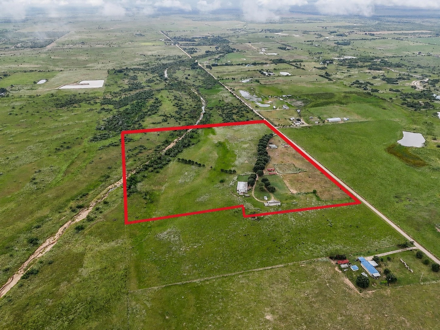 Welcome to 5848 Mieth Road! 29.1 acres with TWO homes- serene county living! (red outline is for reference and not to scale)