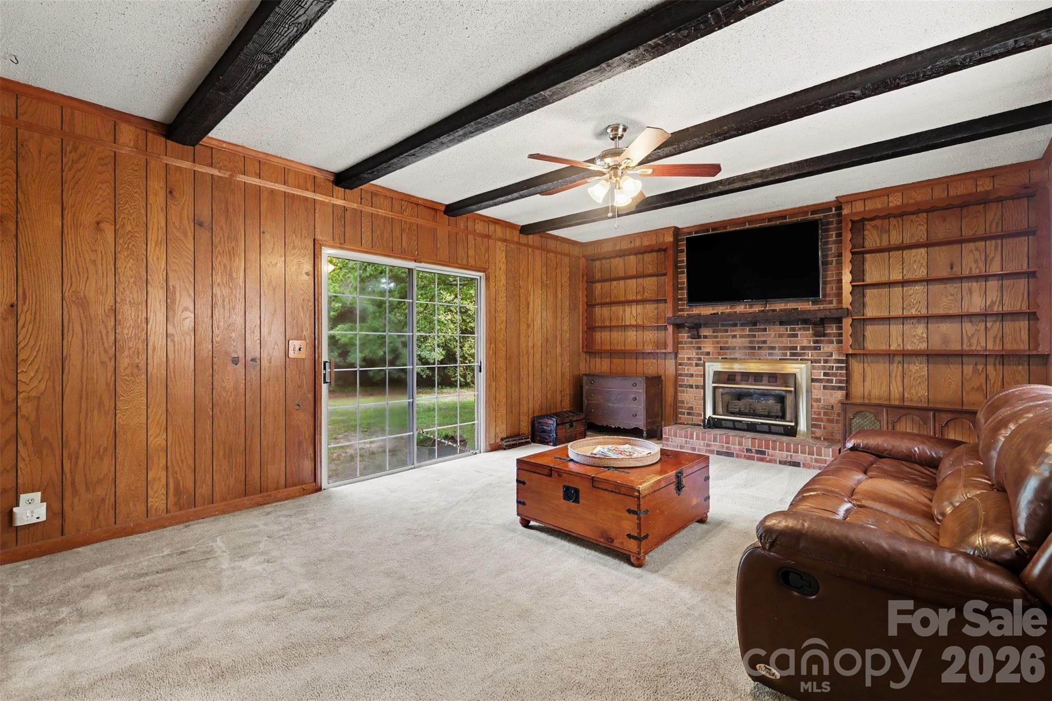 6774 Woodhaven Road Kershaw, SC 29067 - Photo 7 of 30 a living room with fireplace furniture and a flat screen tv