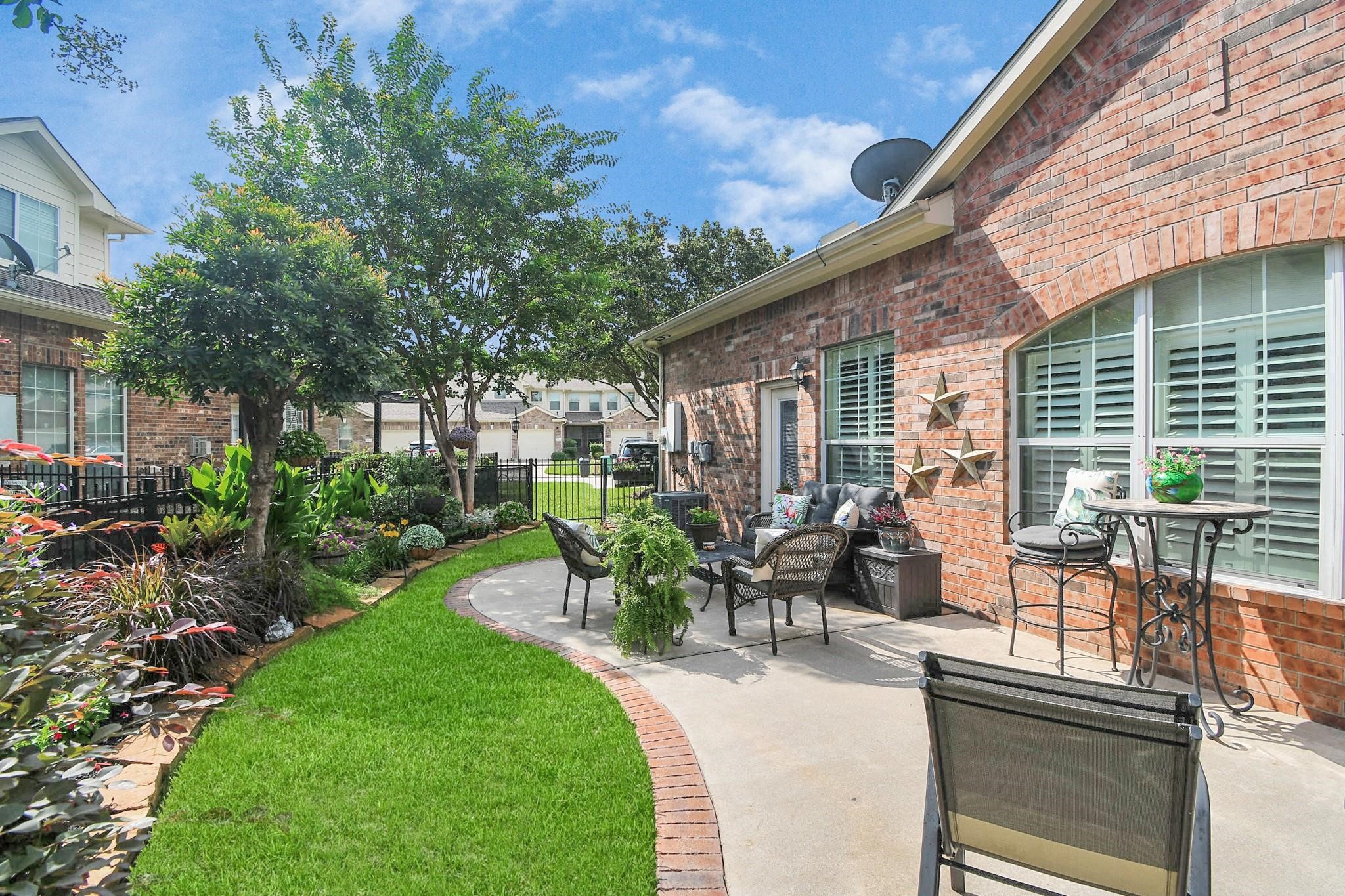 8624 Sunset Loch Drive Spring, TX 77379 - Photo 35 of 44 a view of a backyard with sitting area