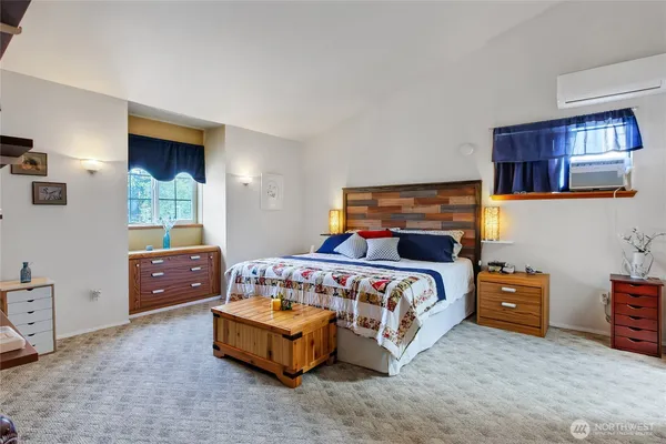 a bedroom with a bed and a cabinets