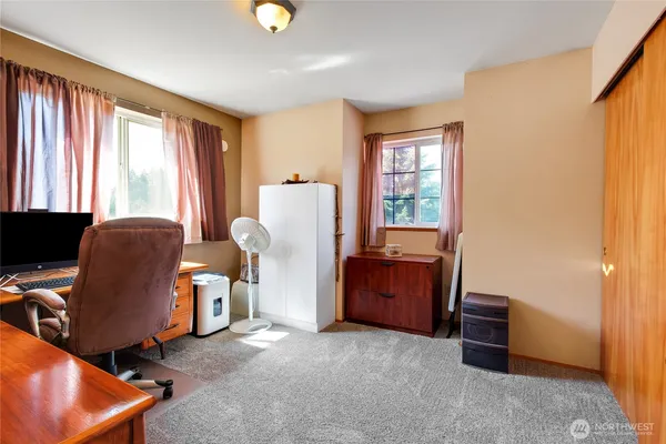 a workspace with furniture and a window