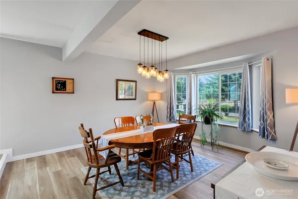a view of a dining room with furniture window and outside view