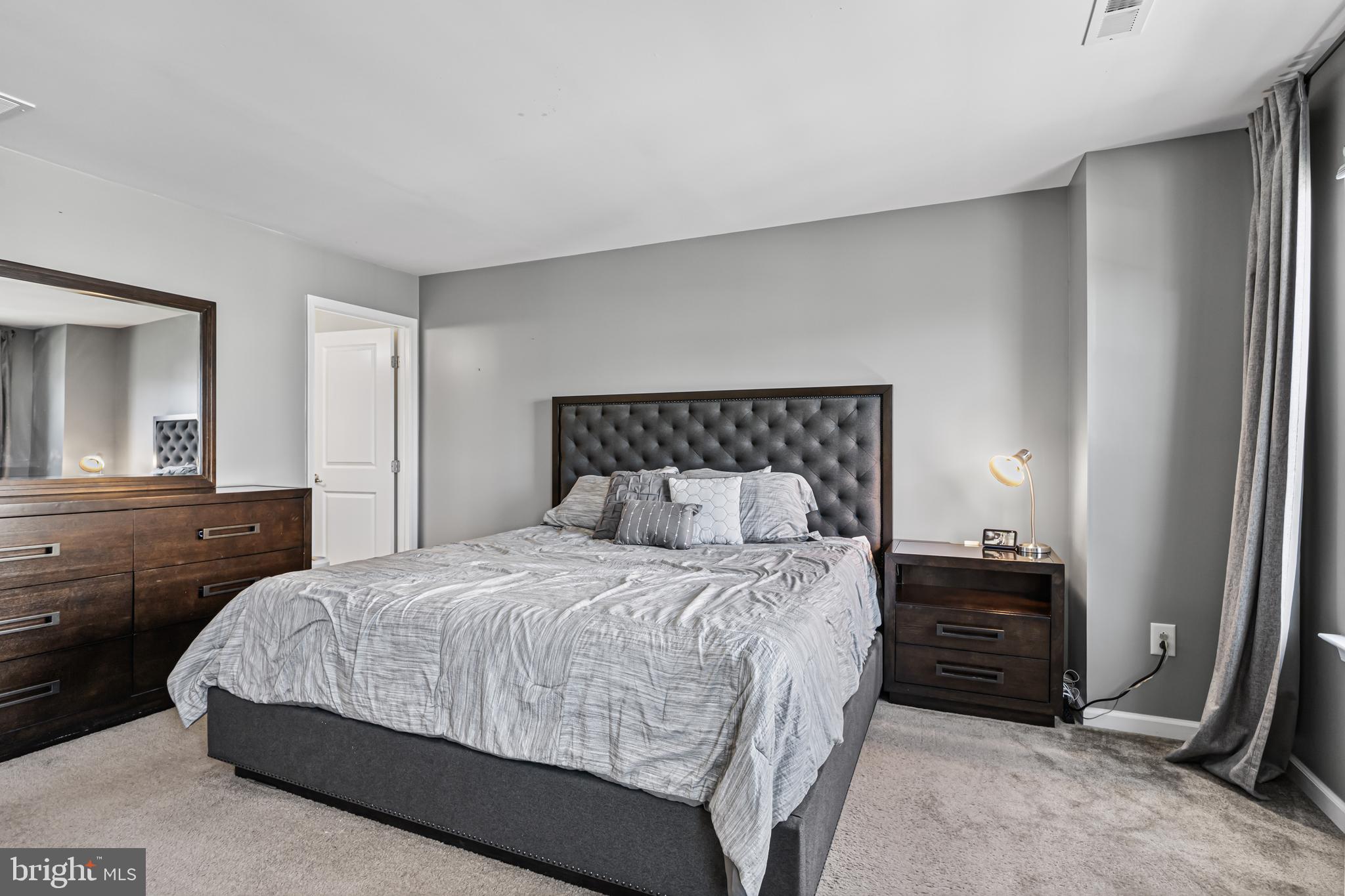 41 Franklin Circle Somerdale, NJ 08083 - Photo 16 of 26 a bedroom with a bed and a mirror