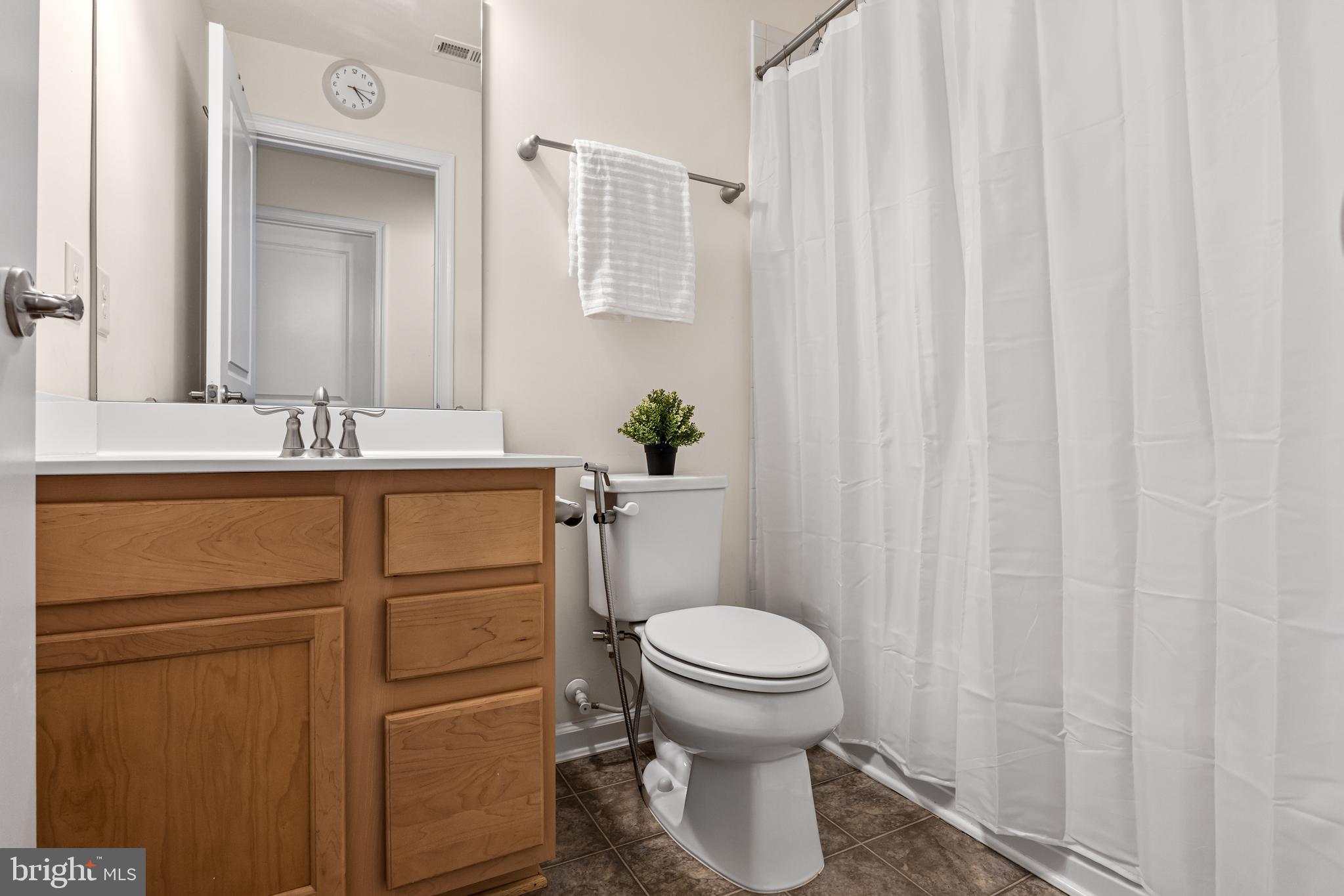 41 Franklin Circle Somerdale, NJ 08083 - Photo 18 of 26 a bathroom with a sink a toilet and a mirror