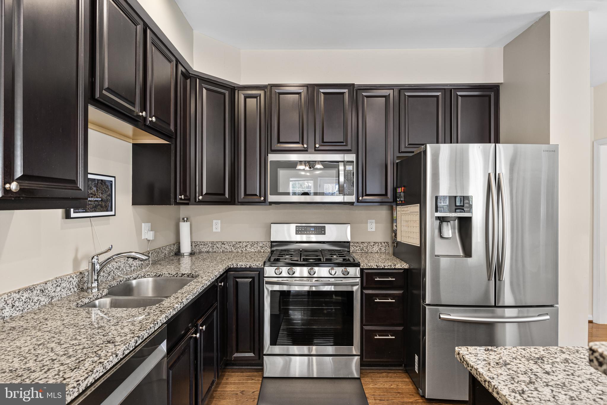 41 Franklin Circle Somerdale, NJ 08083 - Photo 9 of 26 a kitchen with granite countertop a refrigerator stove and sink