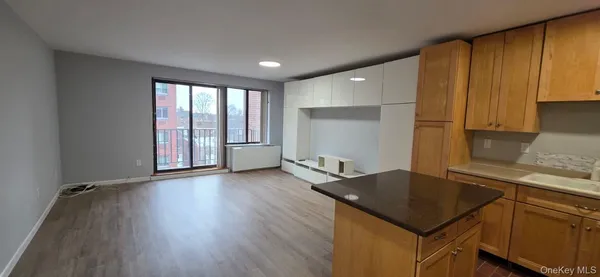 a kitchen with stainless steel appliances granite countertop a refrigerator and a stove