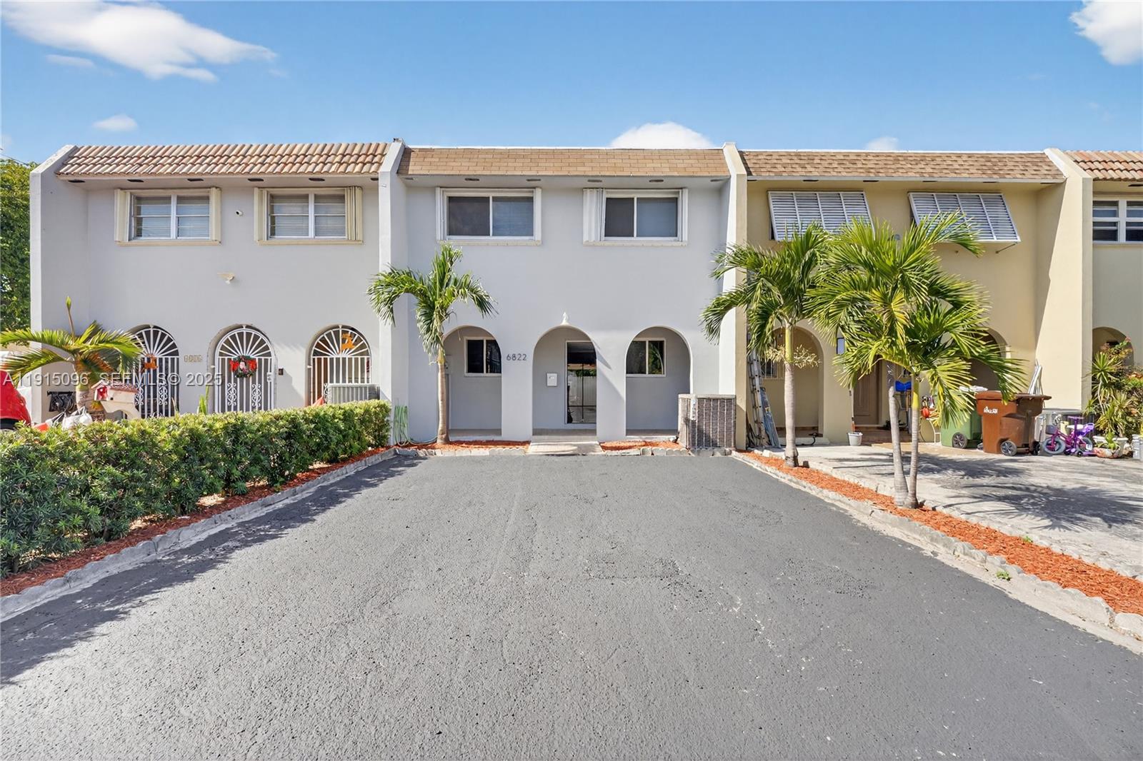 6822 West 2nd Lane Hialeah, FL 33014 - Photo 1 of 36 a view of a white house with a street