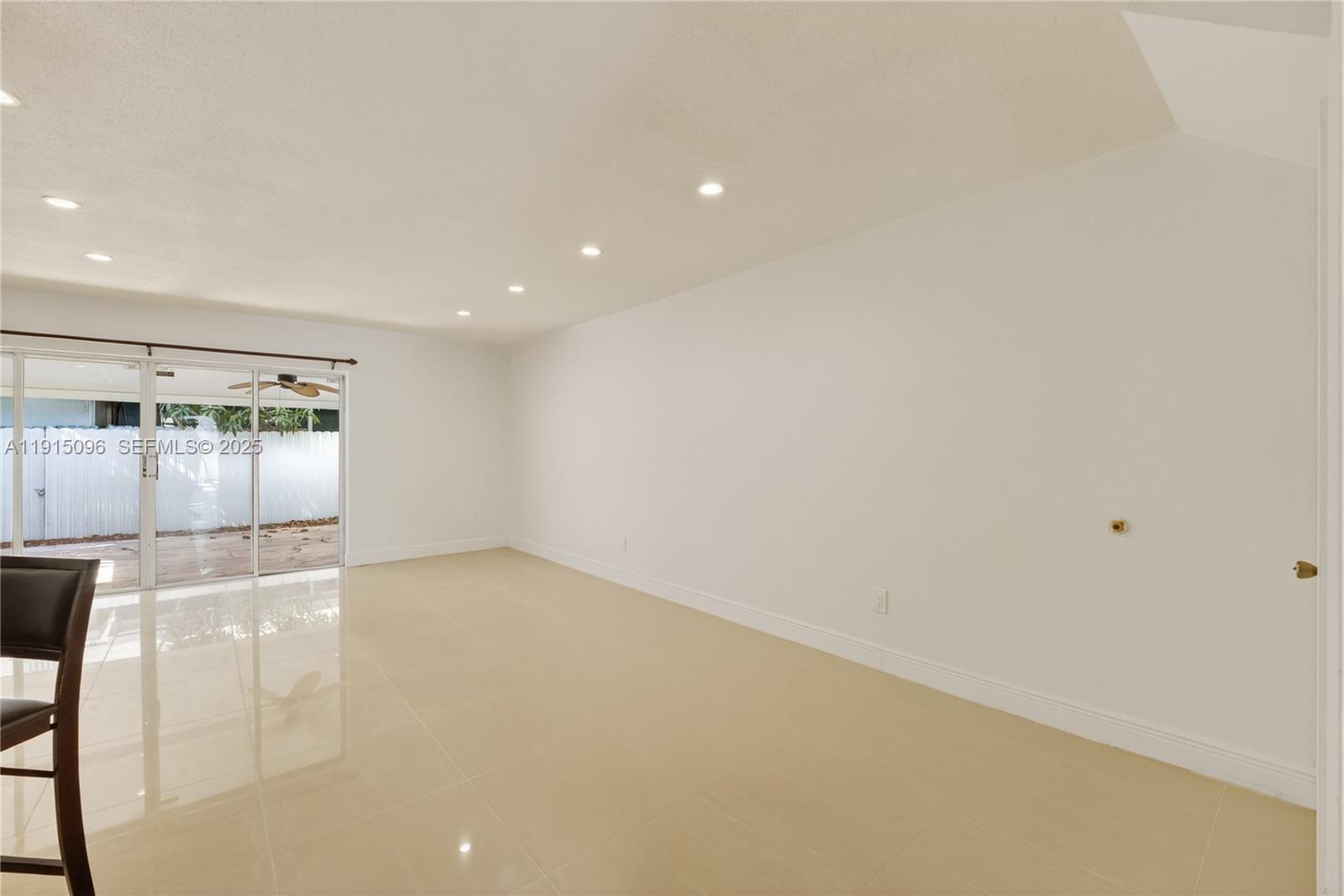6822 West 2nd Lane Hialeah, FL 33014 - Photo 11 of 36 an empty room with kitchen and window