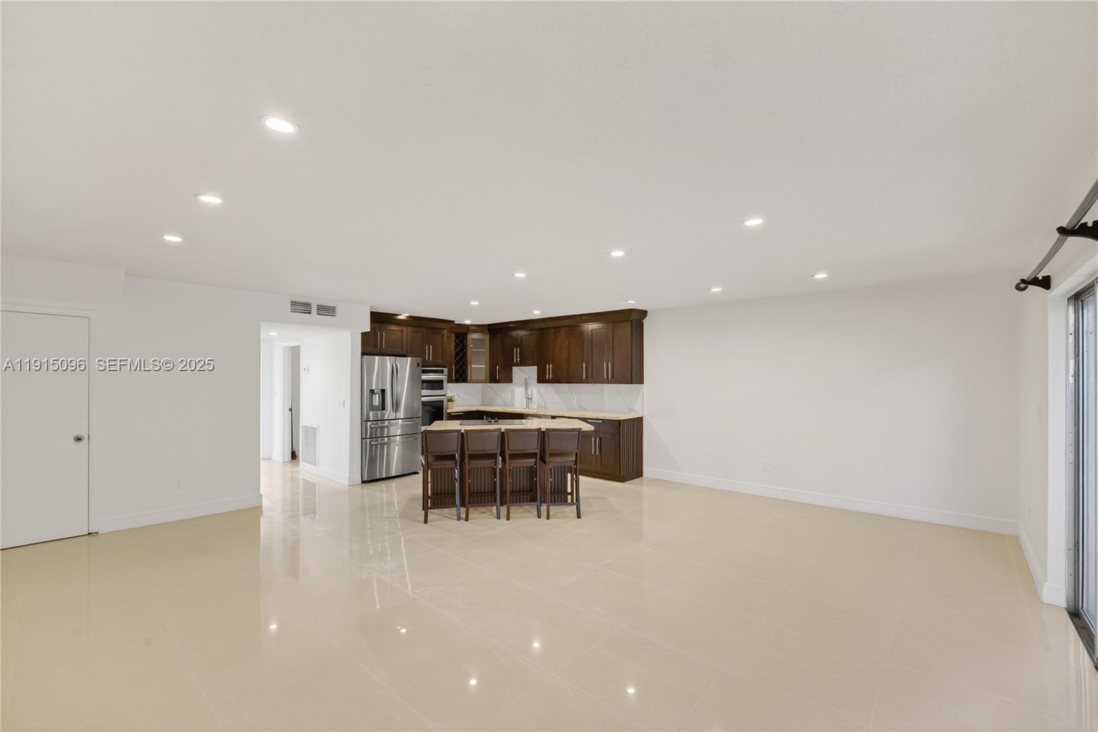 6822 West 2nd Lane Hialeah, FL 33014 - Photo 15 of 36 a view of kitchen with furniture and refrigerator