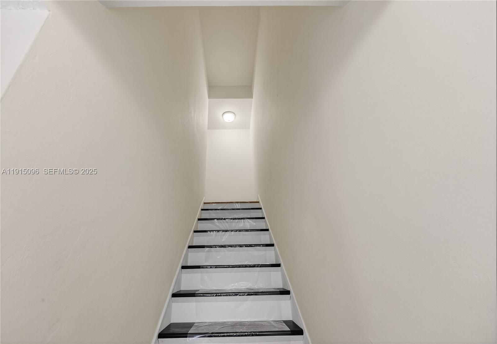 6822 West 2nd Lane Hialeah, FL 33014 - Photo 17 of 36 a view of entryway with stairs