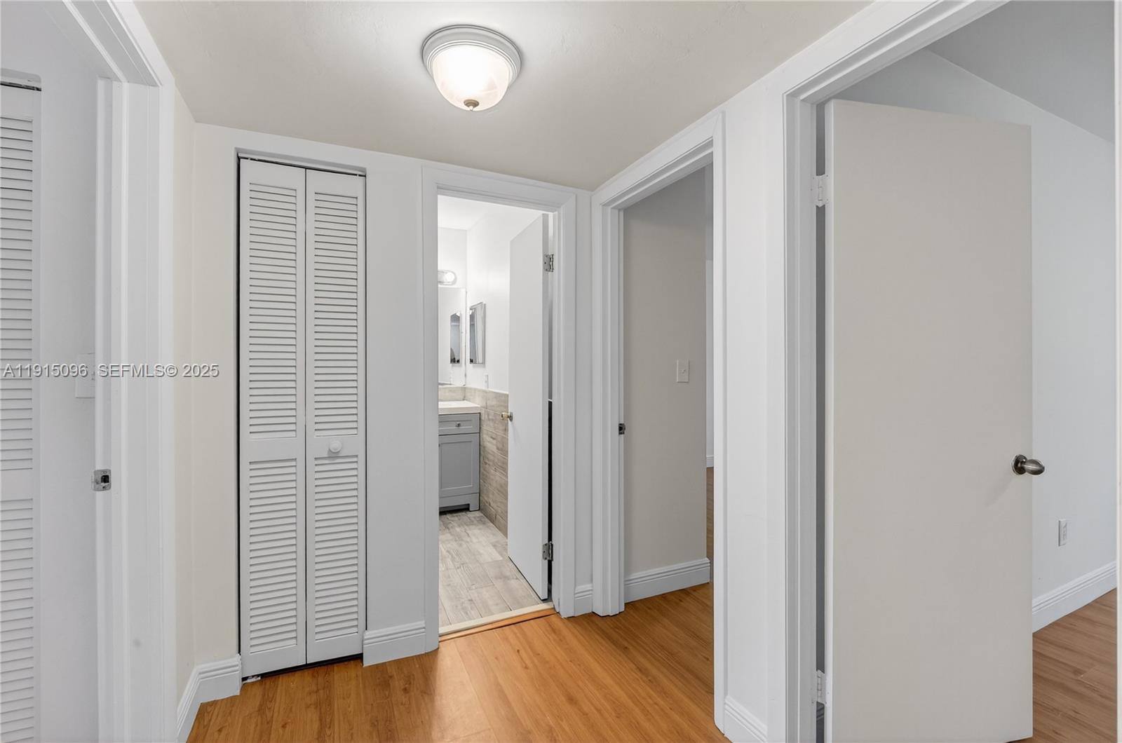 6822 West 2nd Lane Hialeah, FL 33014 - Photo 18 of 36 a view of a bathroom with wooden floor