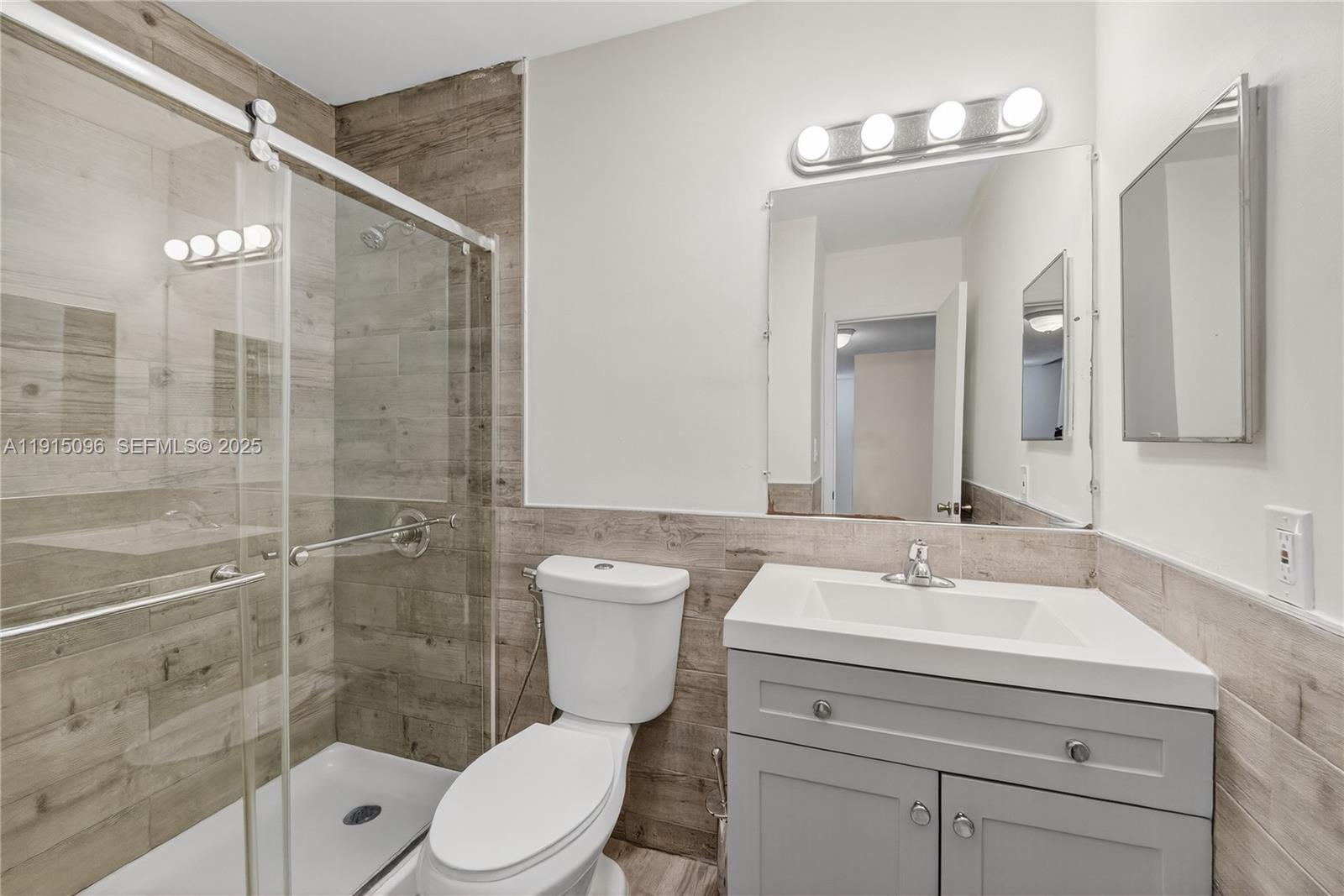 6822 West 2nd Lane Hialeah, FL 33014 - Photo 21 of 36 a bathroom with a sink a toilet and shower