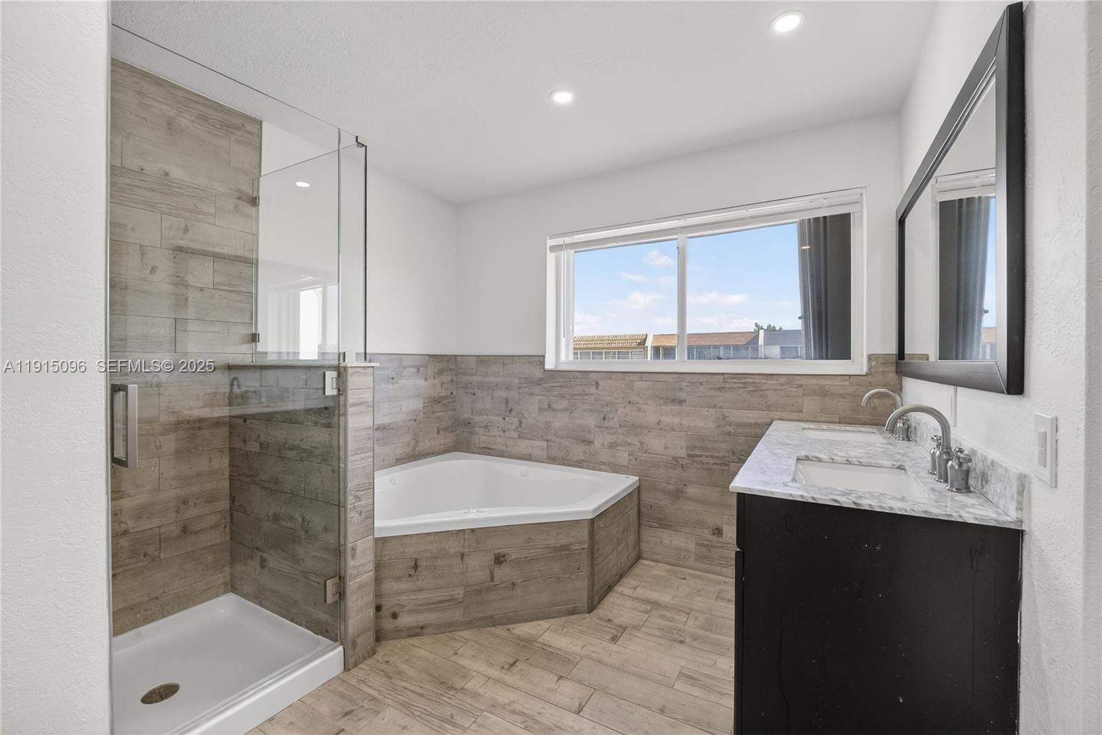6822 West 2nd Lane Hialeah, FL 33014 - Photo 25 of 36 a bathroom with a sink and a bathtub