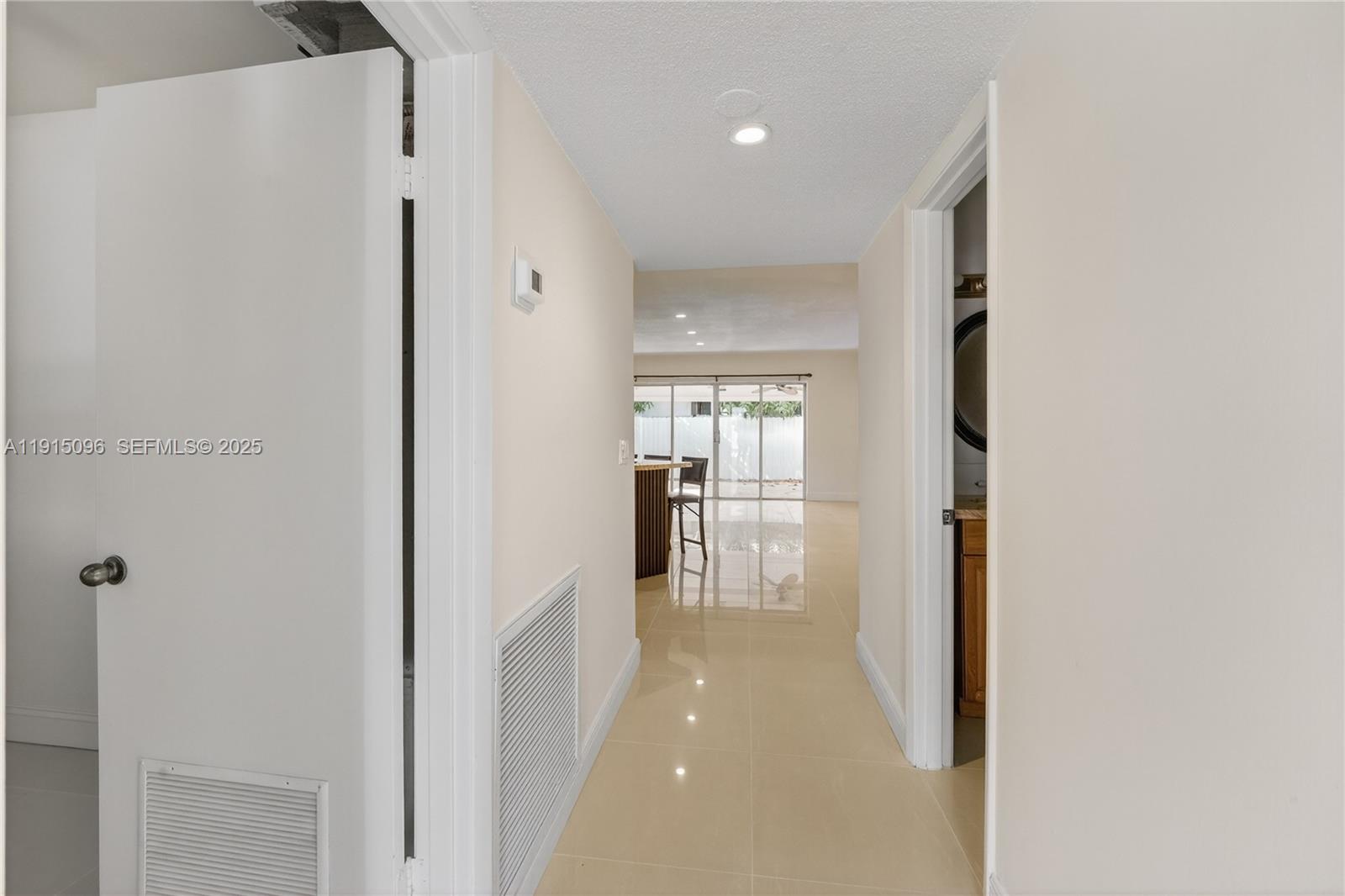 6822 West 2nd Lane Hialeah, FL 33014 - Photo 4 of 36 a view of a hallway with bathroom and a bathroom