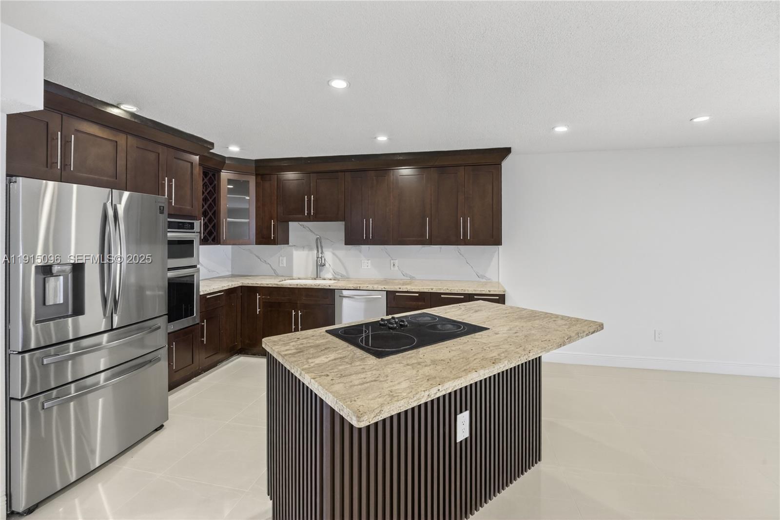 6822 West 2nd Lane Hialeah, FL 33014 - Photo 7 of 36 a kitchen with stainless steel appliances granite countertop a sink stove and refrigerator