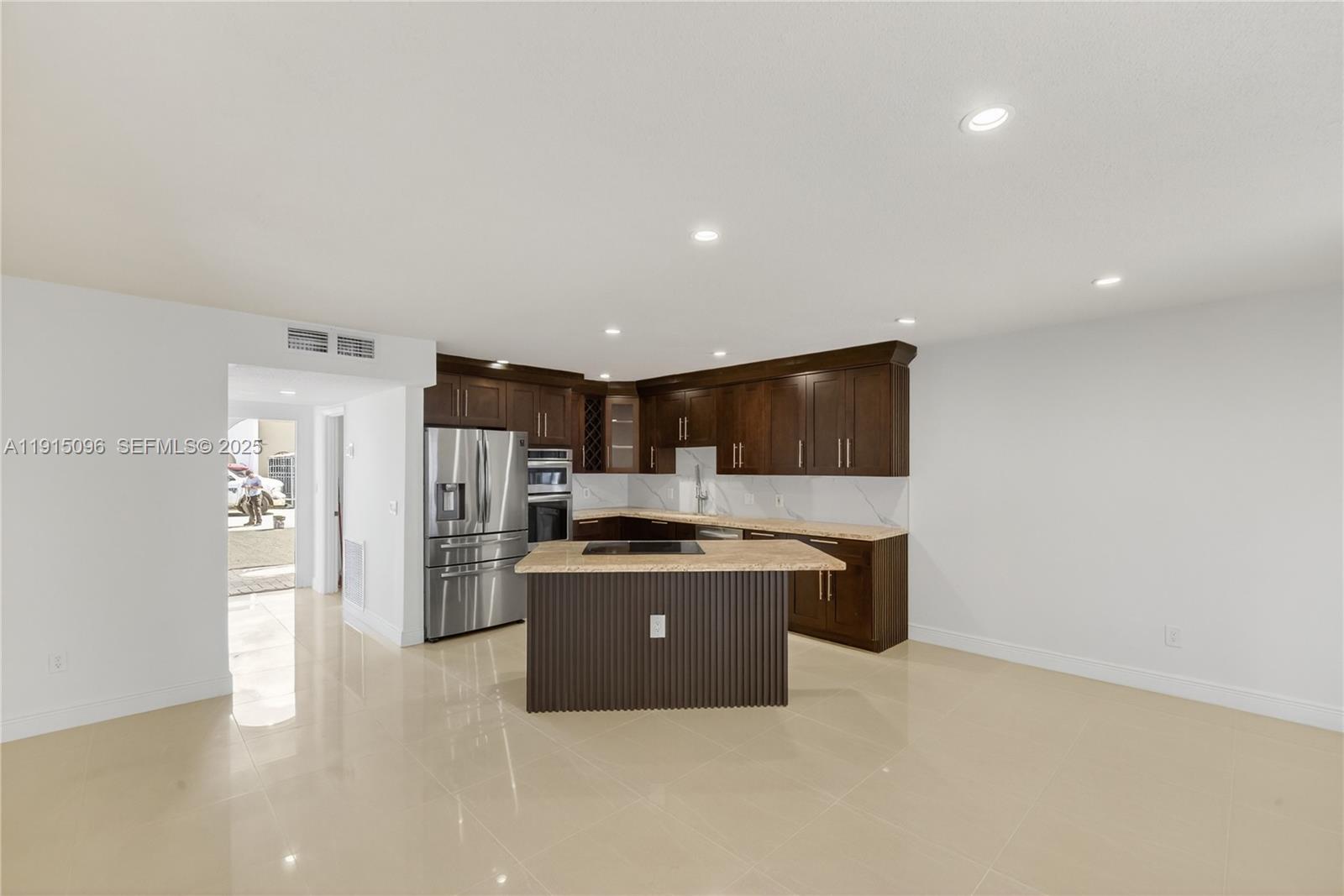 6822 West 2nd Lane Hialeah, FL 33014 - Photo 9 of 36 a view of a kitchen with a sink refrigerator and windows