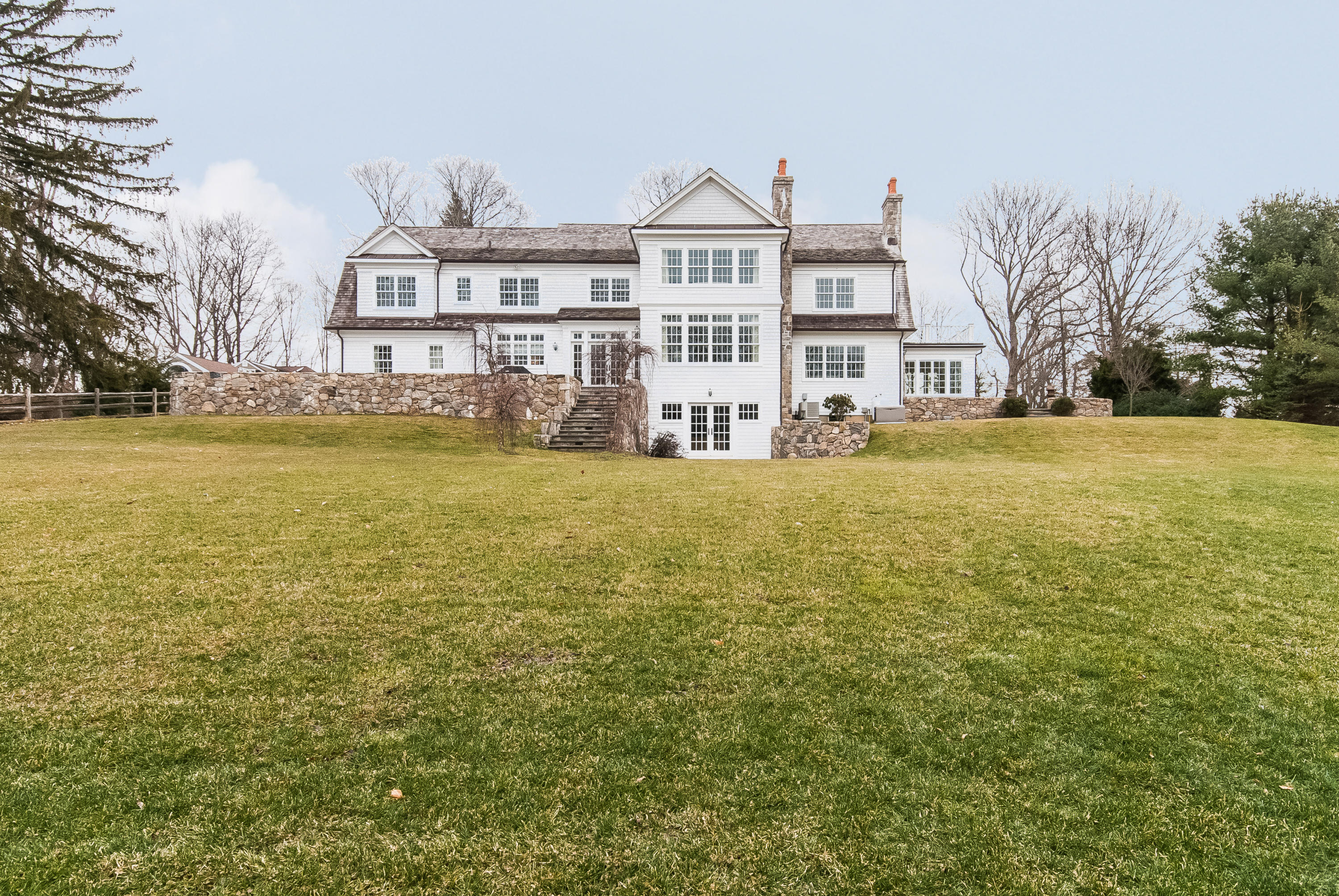 527 Middlesex Road Darien, CT 06820 - Photo 21 of 25 a view of a large building with a big yard and large trees
