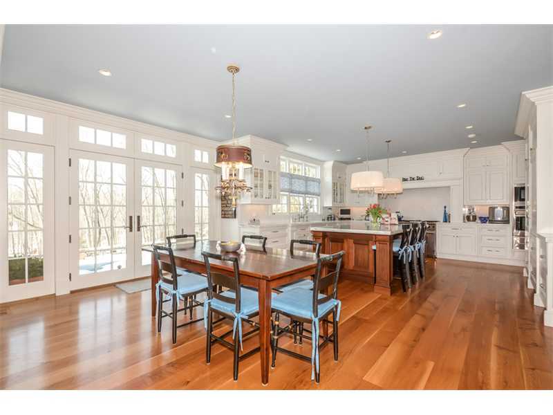527 Middlesex Road Darien, CT 06820 - Photo 8 of 25 a dining room with furniture and wooden floor