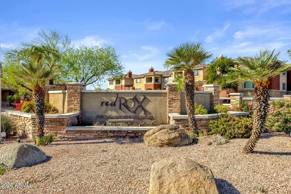 a view of a street with a building in the background