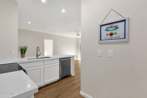 a kitchen with stainless steel appliances a refrigerator and a counter top space
