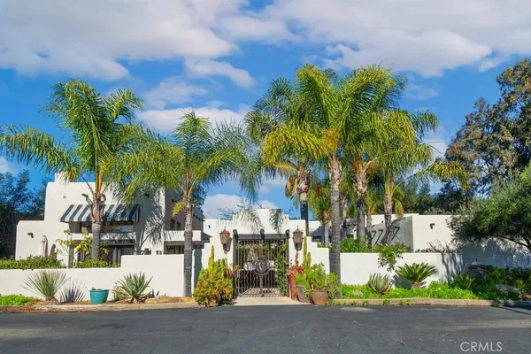 a view of balcony with wooden floor and potted plant
