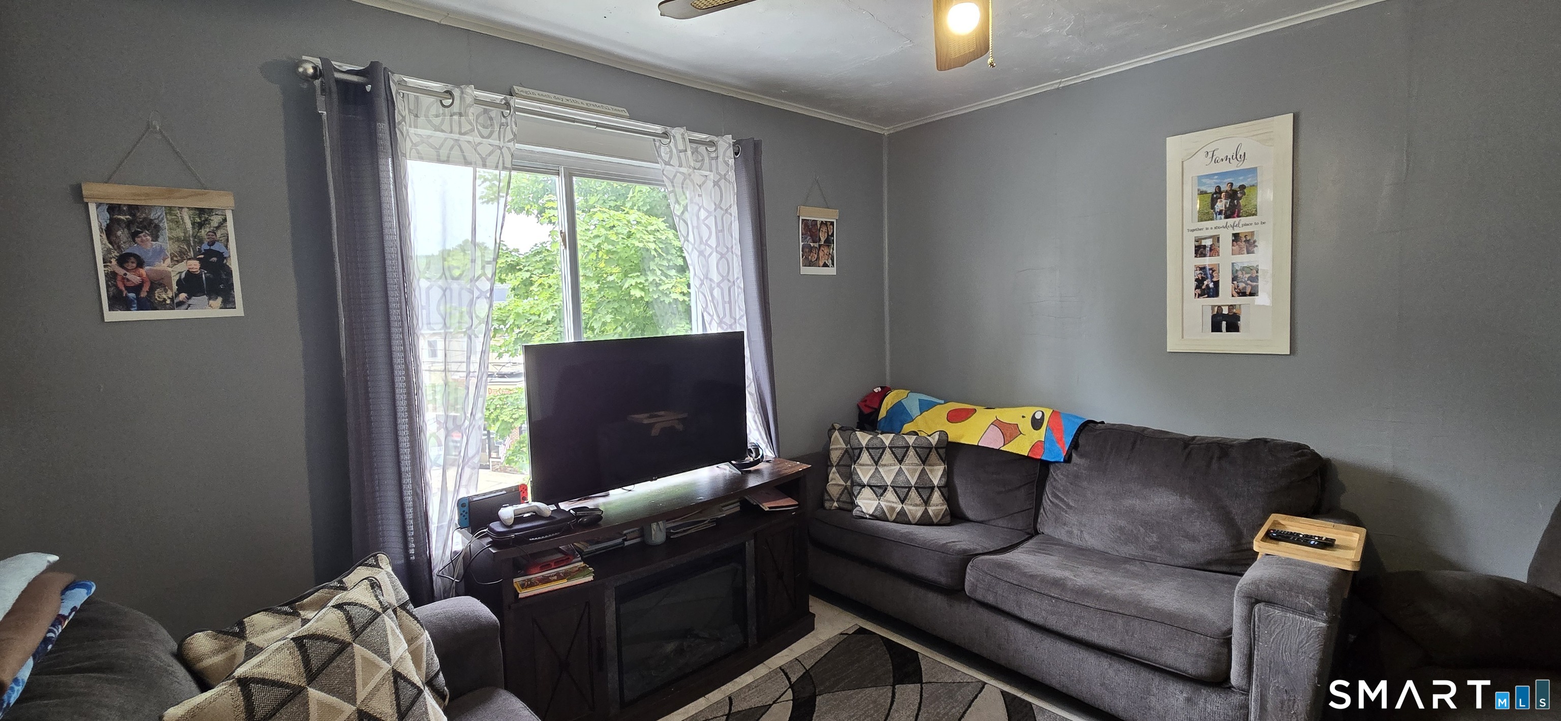 25 High Street Torrington, CT 06790 - Photo 7 of 16 a living room with furniture and a window