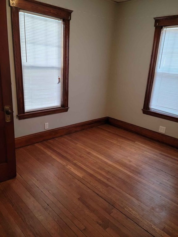57 Austin Street, Unit 2 Boston, MA 02136 - Photo 12 of 17 a view of a room with wooden floor and window