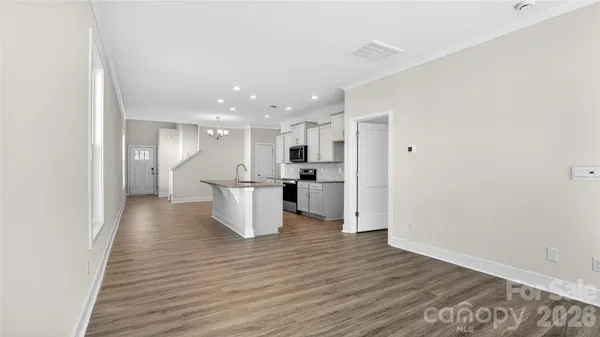 a view of kitchen with wooden floor