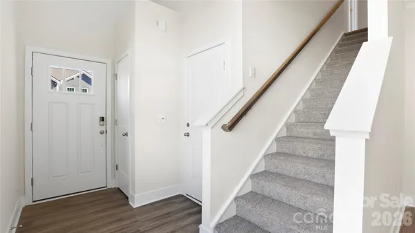 a view of entryway with wooden floor