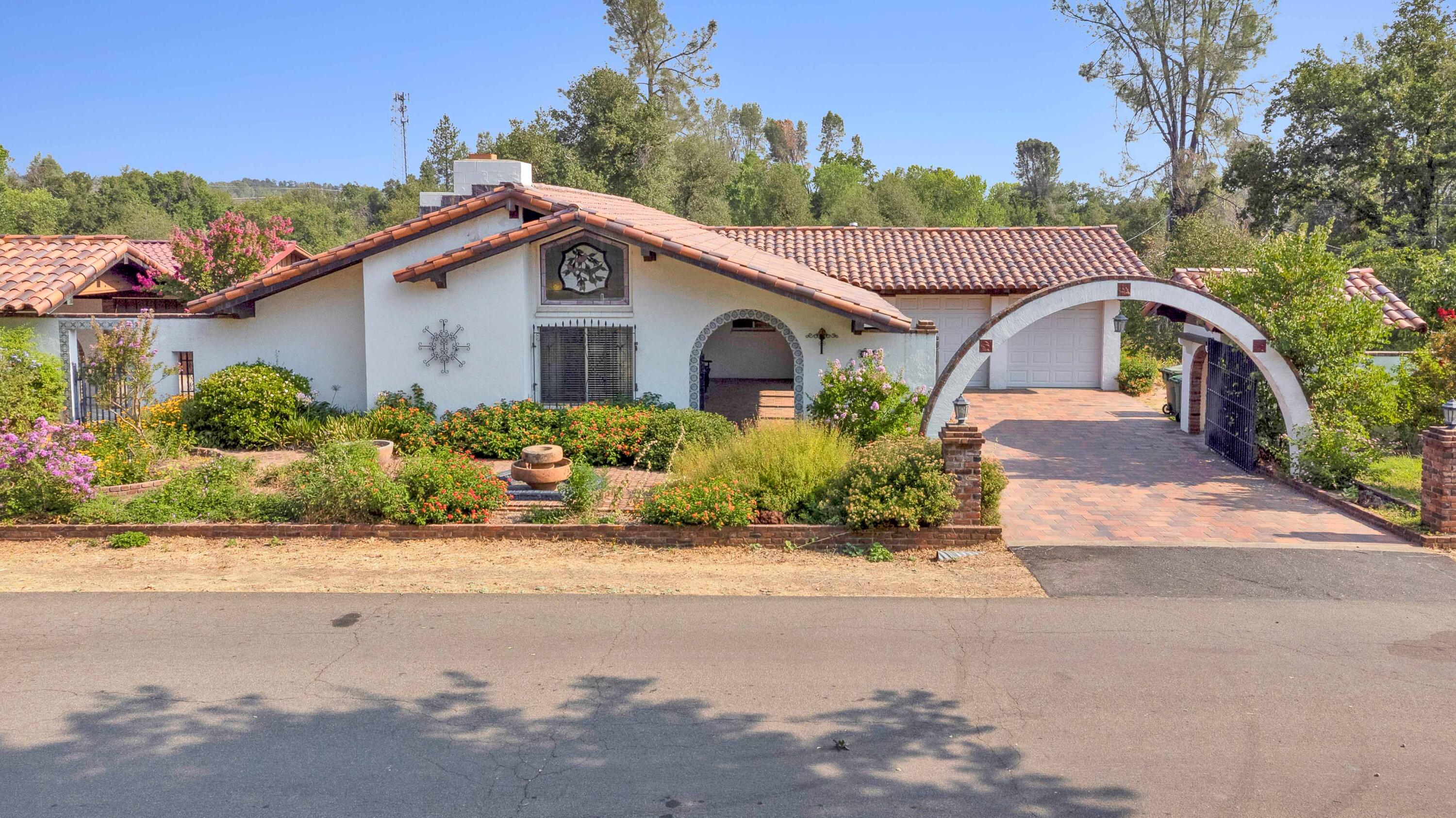 8921 Redbank Road Redding, CA 96001 - Photo 2 of 65 a view of a house with a garden and pathway