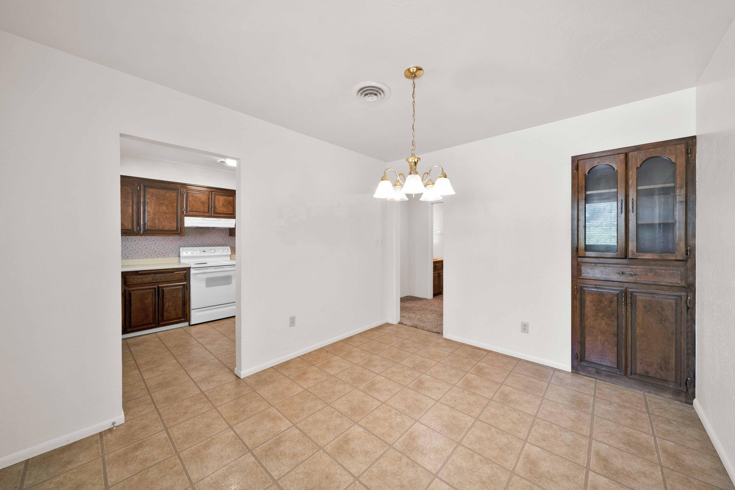 8921 Redbank Road Redding, CA 96001 - Photo 24 of 65 a view of a kitchen with a sink dishwasher and a refrigerator