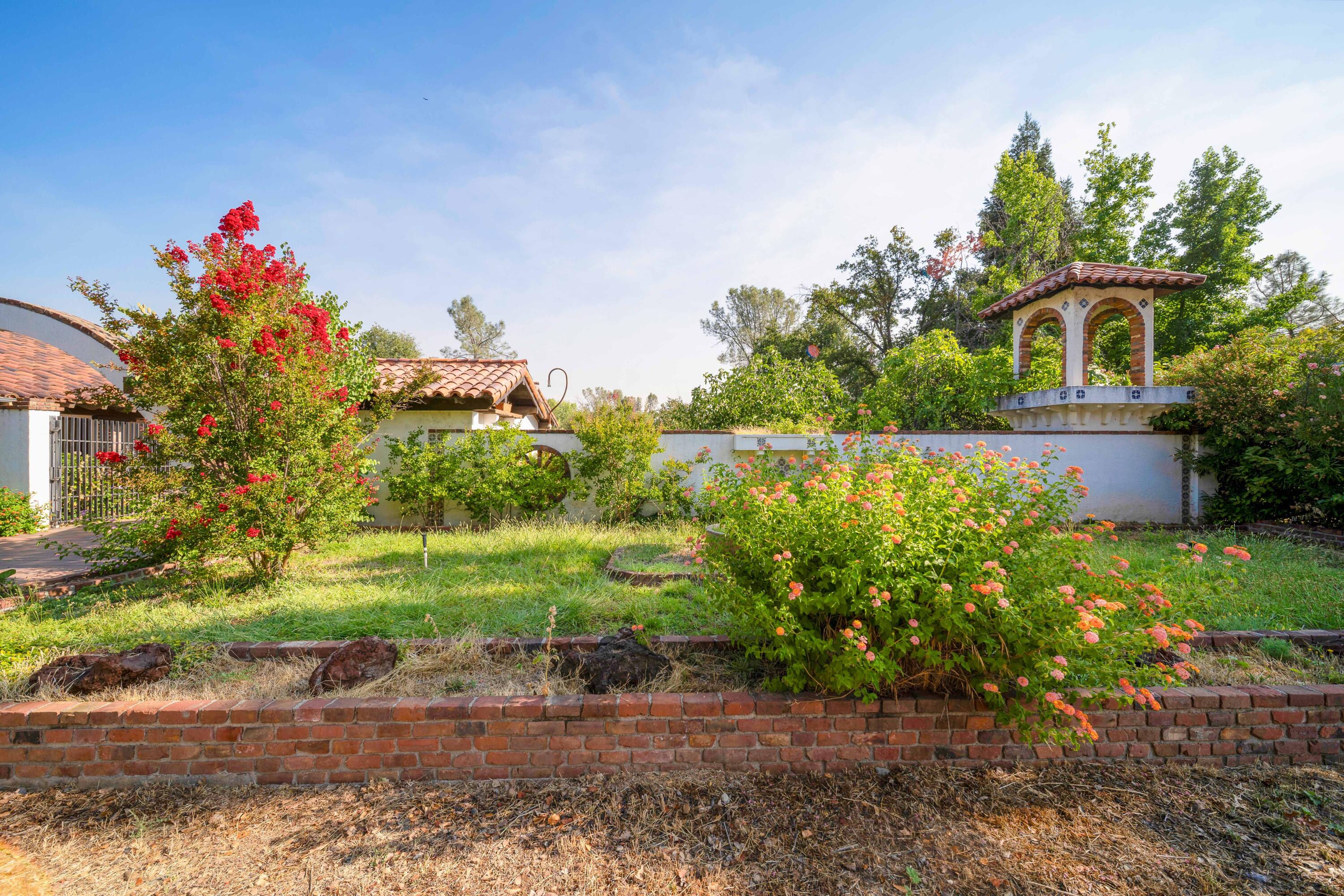 8921 Redbank Road Redding, CA 96001 - Photo 54 of 65 a front view of a house with a yard