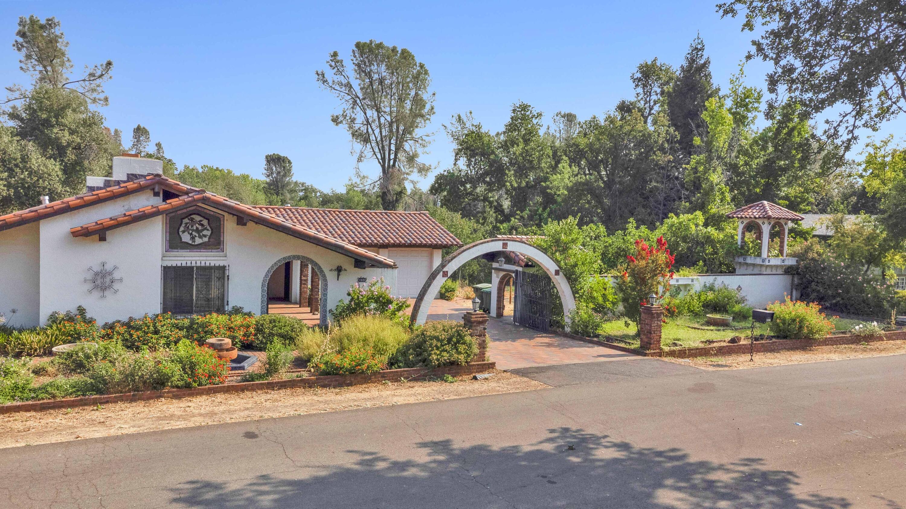 8921 Redbank Road Redding, CA 96001 - Photo 62 of 65 front view of a house with a small yard