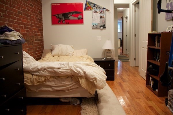 1089 Beacon Street, Unit 1 Brookline, MA 02446 - Photo 7 of 14 a bedroom with a bed and a television