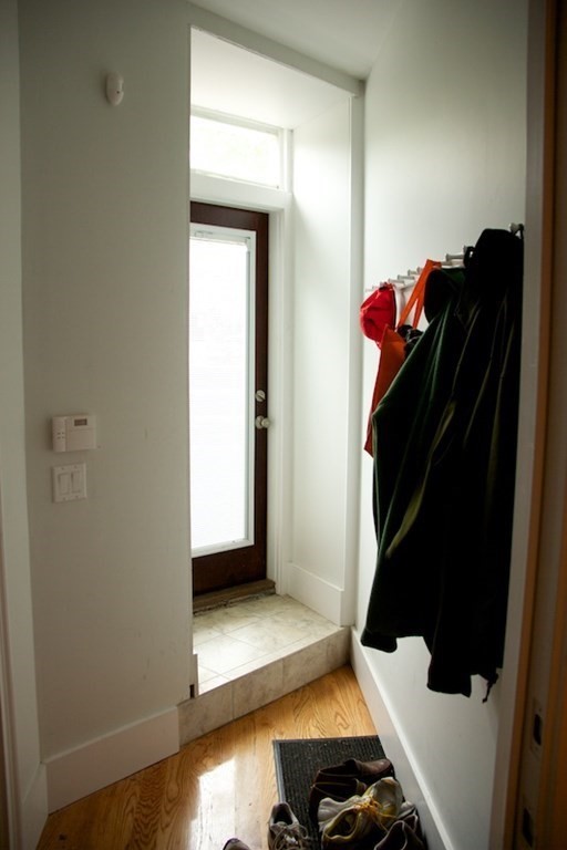 1089 Beacon Street, Unit 1 Brookline, MA 02446 - Photo 9 of 14 a view of walk in closet with clothes and shoes