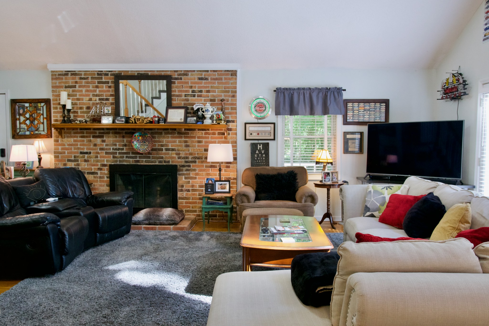 3203 Austin Bottom Road Baxter, TN 38544 - Photo 12 of 41 a living room with furniture a flat screen tv and a fireplace