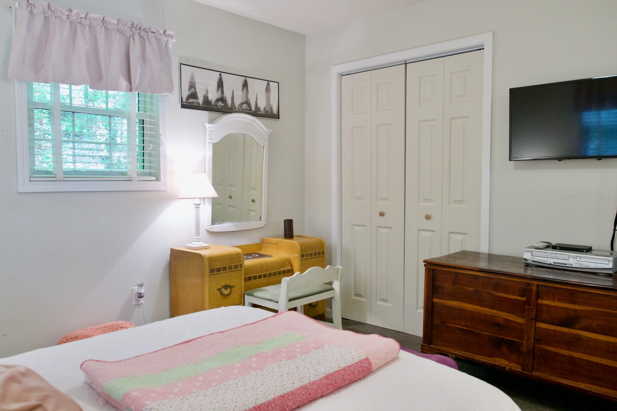3203 Austin Bottom Road Baxter, TN 38544 - Photo 20 of 41 a bedroom with a bed and a flat tv screen on the dresser