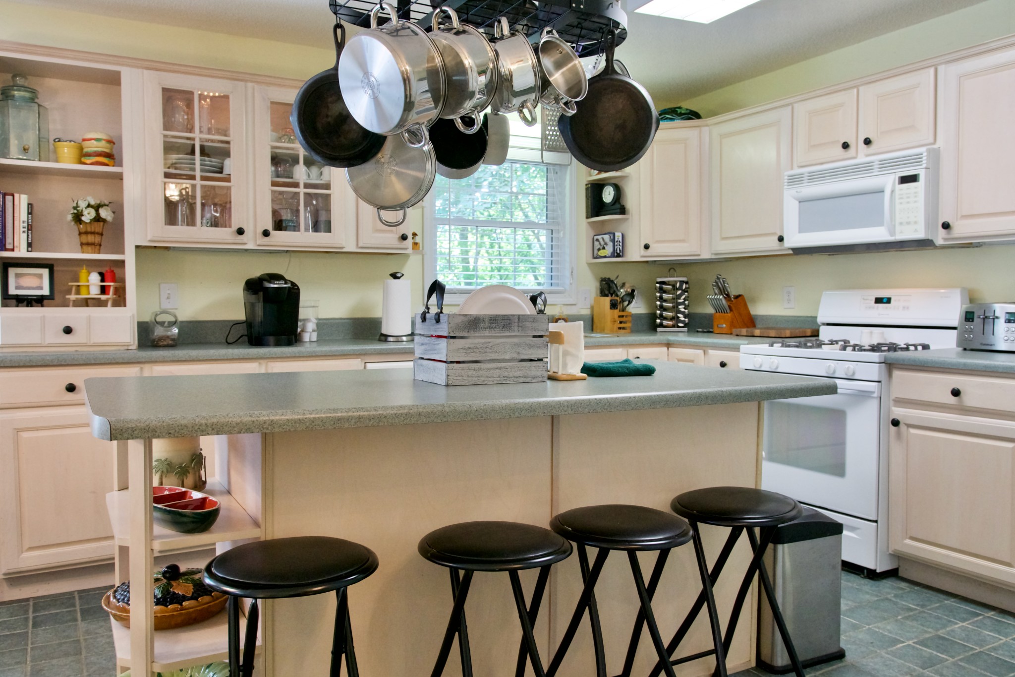 3203 Austin Bottom Road Baxter, TN 38544 - Photo 25 of 41 a kitchen with stainless steel appliances a table chairs in it and wooden floors