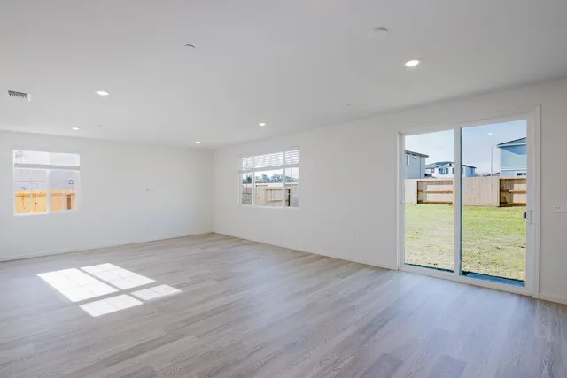 a kitchen with stainless steel appliances a sink stove and cabinets