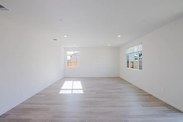 a kitchen with kitchen island a refrigerator stove and microwave