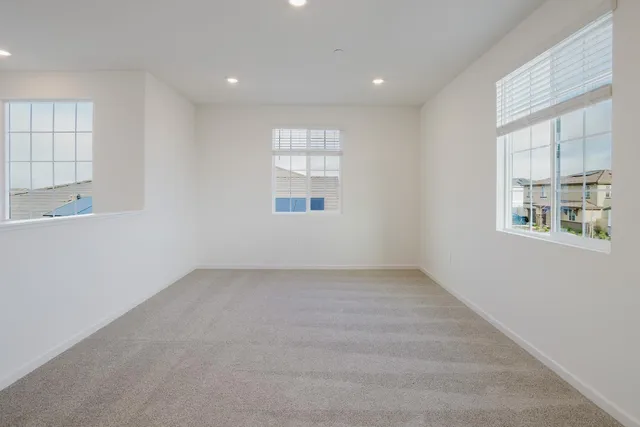 a white bath tub sitting next to a window