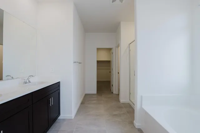 a bathroom with a shower and a tub