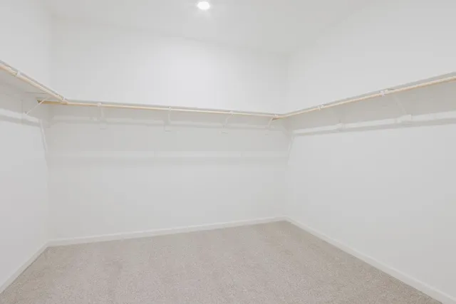 an empty room with a empty space and window