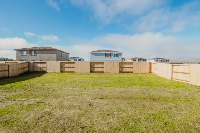 a view of hallway with wooden floor
