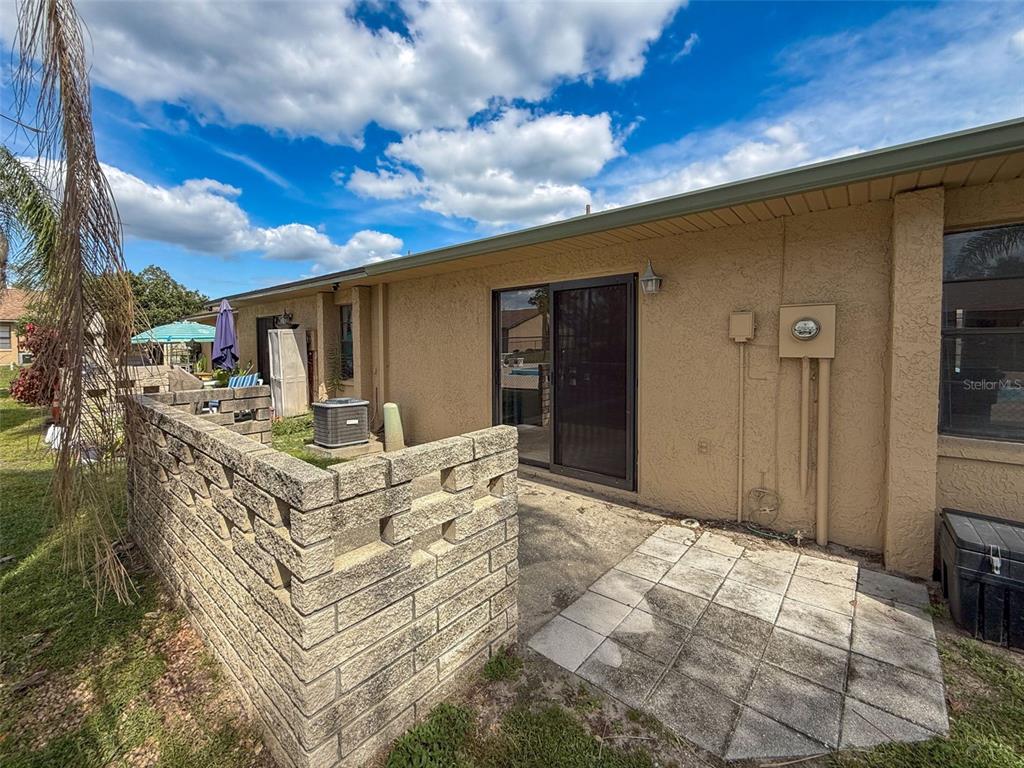 7116 Barclay Avenue, Unit B Spring Hill, FL 34609 - Photo 27 of 31 a view of a house with backyard