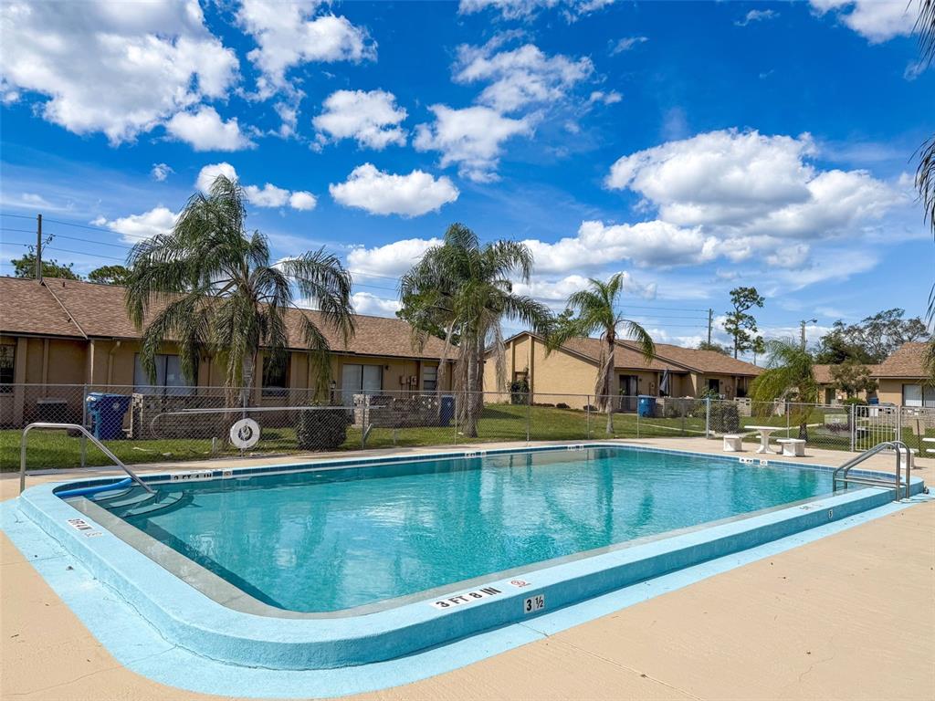 7116 Barclay Avenue, Unit B Spring Hill, FL 34609 - Photo 31 of 31 a view of a swimming pool with outdoor seating