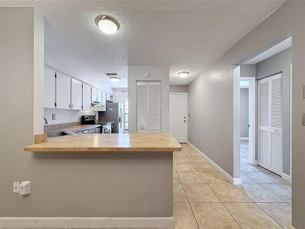 7116 Barclay Avenue, Unit B Spring Hill, FL 34609 - Photo 6 of 31 a view of kitchen with stainless steel appliances granite countertop a sink and cabinets