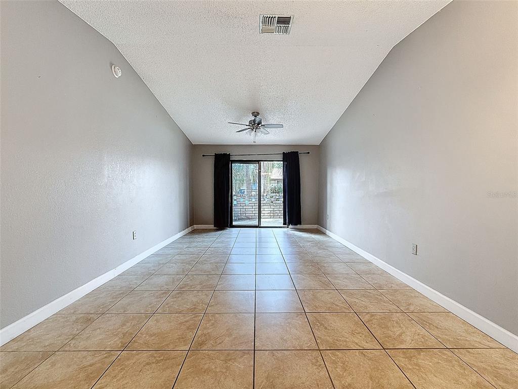 7116 Barclay Avenue, Unit B Spring Hill, FL 34609 - Photo 10 of 31 a view of an empty room with a window
