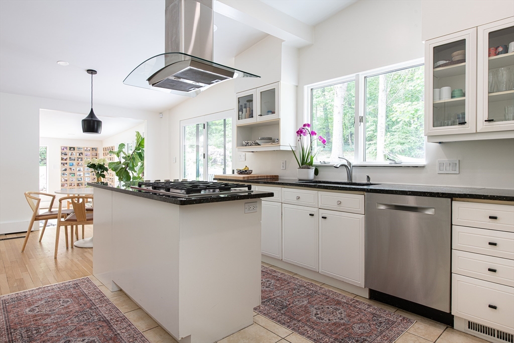 7 Diamond Road Lexington, MA 02420 - Photo 13 of 42 a kitchen with granite countertop a stove a sink and a chandelier